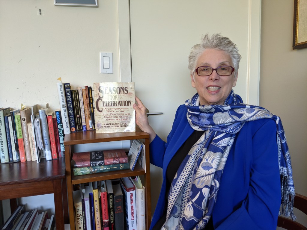 This image has an empty alt attribute; its file name is pzmiller-in-front-bookcase.jpg